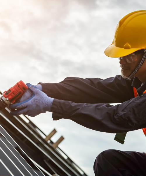 A man wearing a hard hat and safety gear